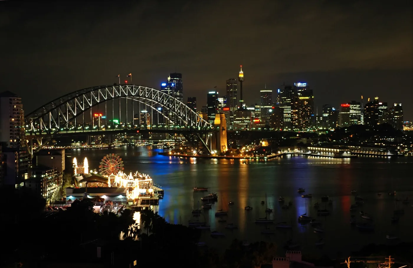 Sydney Harbour Bridge and city skyline lit at night