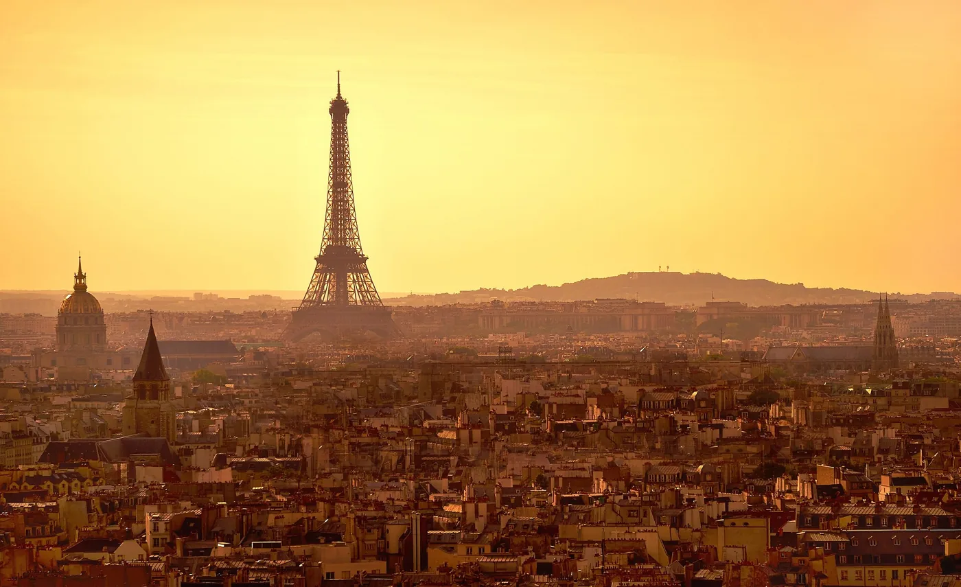Paris rooftops and the Eiffel Tower at sunset