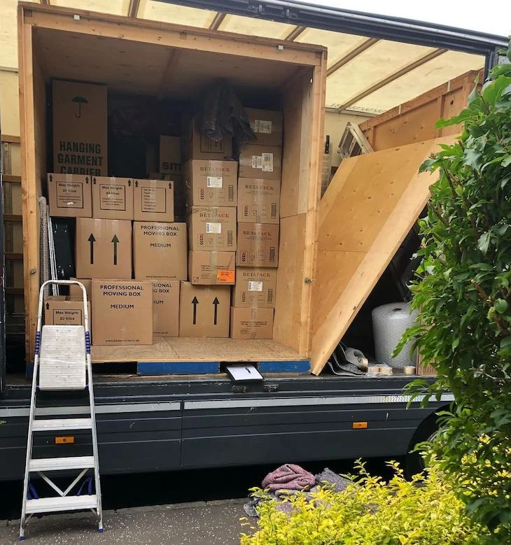 Household belongings carefully loaded into a removal vehicle